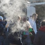 Fans smoke prior to the game during the NFL Fan Fest. Walking around the venue, you could see fans eating bratwurst and other classic Bavarian foods, while also taking a smoke break.