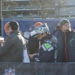 A Seahawks fan waits in line to order from a Bavarian food truck during the NFL Fan Fest. The smells of bratwurst wafted through the air as American tunes played prior to the start of the game.