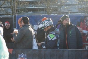 A Seahawks fan waits in line to order from a Bavarian food truck during the NFL Fan Fest. The smells of bratwurst wafted through the air as American tunes played prior to the start of the game.