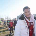 A Bayern Munich fan smiles as he checks out the NFL Fan Fest. Typically, instead of NFL football, Allianz Arena is home to Bayern Munich’s sold-out soccer games.