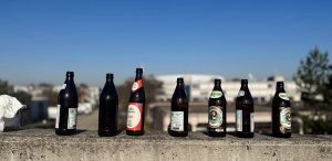 Beer bottles were scattered along the walkway from the U-Bahn station to the arena. Many people in Germany leave the bottles out so that they can be exchanged for money after being cleaned up by those searching for work.