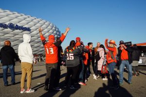 Buccaneers fans prepare for their team’s football game by cheering and chanting “Go Bucs” as fans from all over the world walk towards Allianz Arena. The Tampa Bay Buccaneers defeated the Seattle Seahawks in a first of its kind game in Munich, Germany.