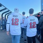 Two fans walk to NFL Fan Fest in identical Tom Brady jerseys. Brady jerseys were legion at Allianz Arena as the legendary quarterback plays his returning season after a short retirement in the spring.