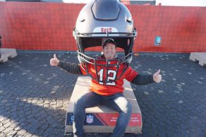 Fans traveled from around the world, many from Tampa, Florida, home of the Buccaneers. Fans lined up posing with their hometown or favorite teams inside of larger-than-life football helmets.