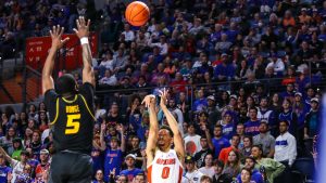 Florida guard Myreon Jones knocking down the 3-point basket to give the Gators the lead over the Missouri Tigers