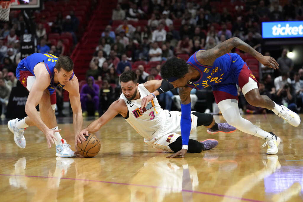 Denver Nuggets guard Christian Braun (0) shoots the ball against the Miami  Heat during the first