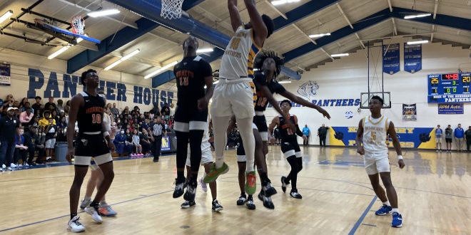 Newberry Basketball Logan Mcloud making a layup