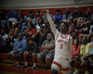 Santa Fe High's Jamil Watson Jr. (2) shoots the ball.