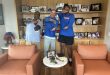 Gators head coach Billy Napier with new OT commit Mike Williams do the gator chomp in Napier's office.