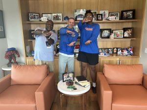 Gators head coach Billy Napier with new OT commit Mike Williams do the gator chomp in Napier's office.