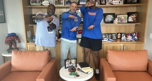 Gators head coach Billy Napier with new OT commit Mike Williams do the gator chomp in Napier's office.