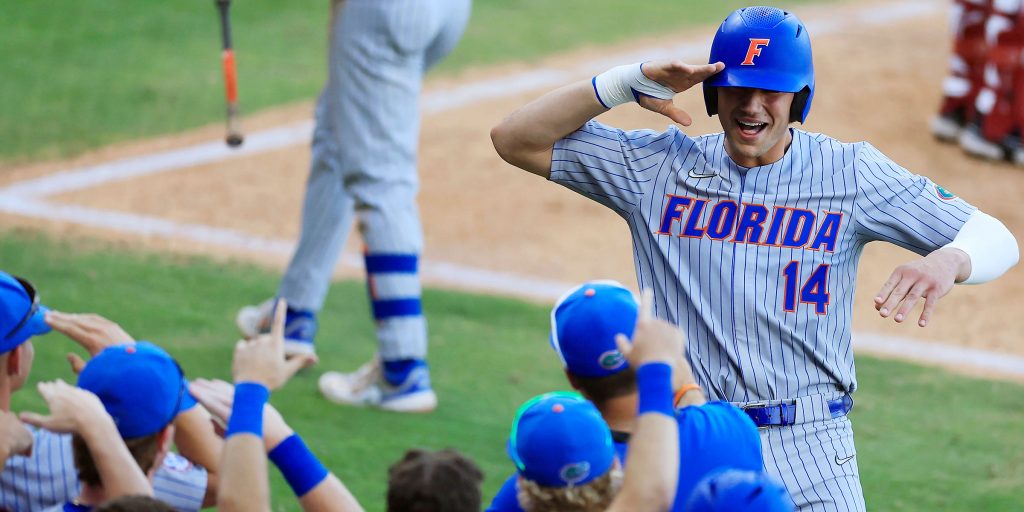 Florida first baseman Jac Caglianone salutes his teammates on the way back to the dugout after hitting a home run.