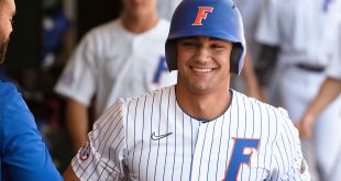 Florida Gators star Jac Caglianone smiles in the dugout after hitting a home run at Condron Family Ballpark.
