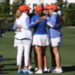Florida women's golf players gather in a huddle during the 2024 SEC Championship.