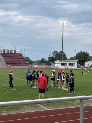 teams huddling before the game starts