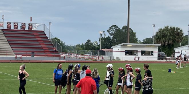 teams huddling before the game starts