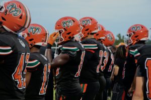Eastside High School Football players lined up on sideline