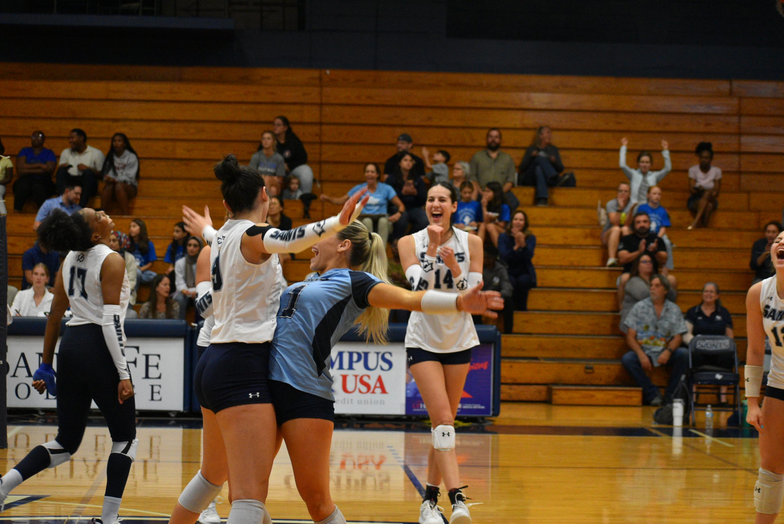 Santa Fe volleyball team celebrating after a point.