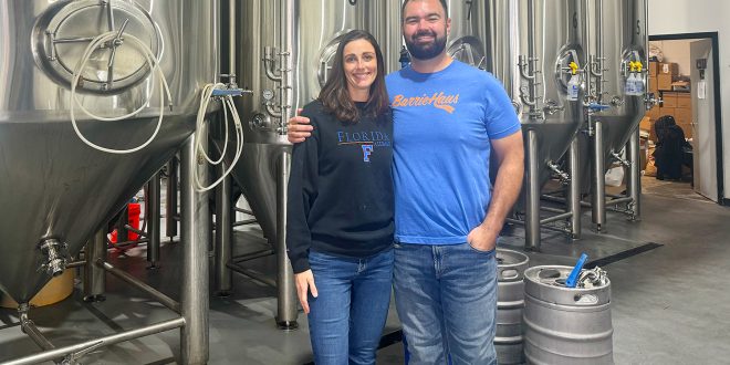 Former Gators lineman Jim Barrie (right) and his wife Brittney opened BarrieHaus Beer Co. in Ybor City in 2019.
