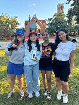 Club members show off their merch of F1 driver Carlos Sainz