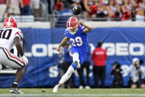 Florida Gators kicker Trey Smack (29) kicks the football.