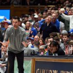 Coach Todd Golden screams as crowd cheers during Florida's loss to Duke.