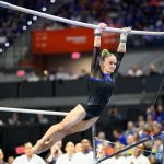 Riley McCusker swings on the bars as Florida gymnastics beat Arkansas on Friday, Jan. 30, in Gainesville.