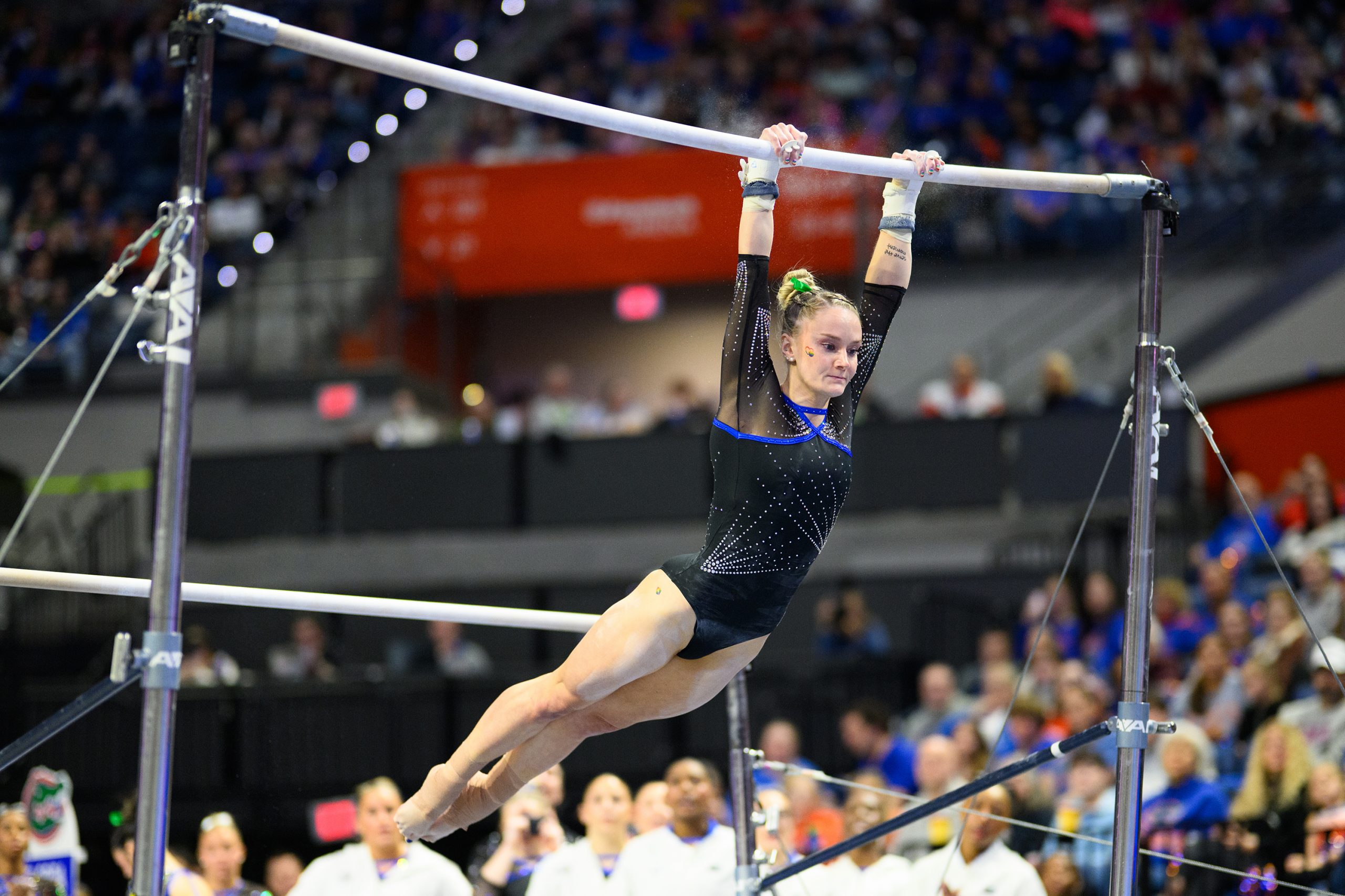 Riley McCusker swings on the bars as Florida gymnastics beat Arkansas on Friday, Jan. 30, in Gainesville.