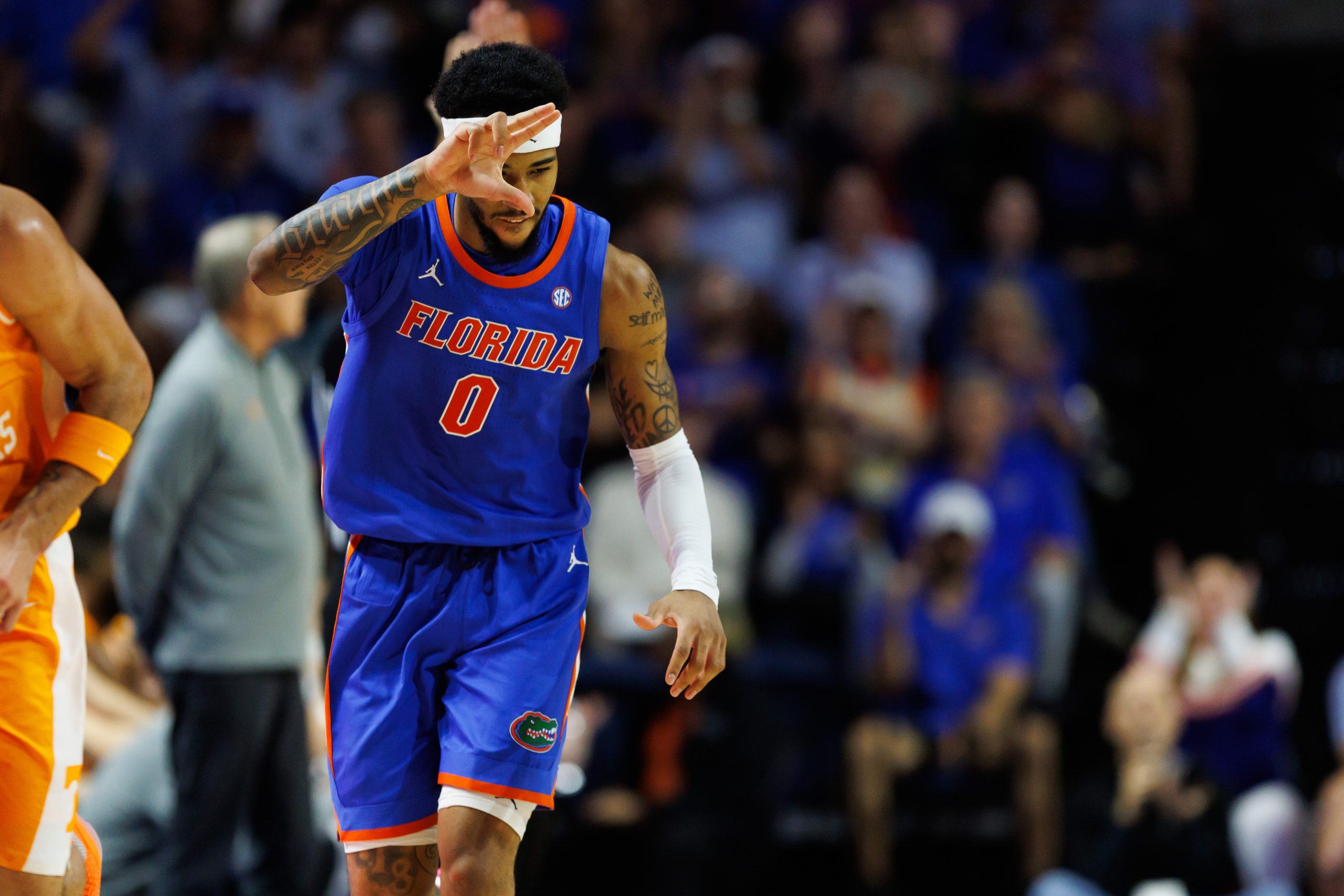 Florida Gators guard Boogie Fland (0) gestures after making a 3-point basket Saturday against the Tennessee Volunteers during the first half at Exactech Arena at the O'Connell Center.