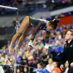 Senior Selena Harris-Miranda dismounts the bars in her first all-around performance of the season against Arkansas.