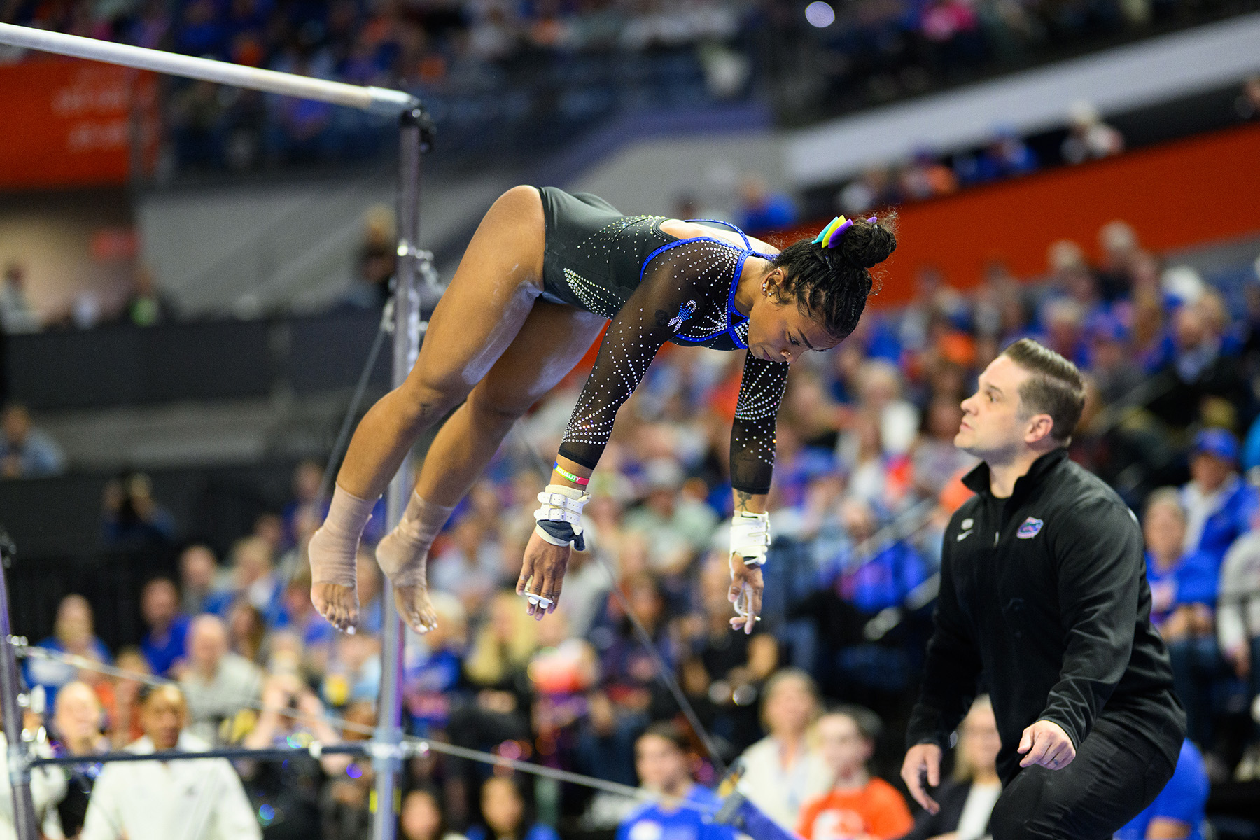 Senior Selena Harris-Miranda dismounts the bars in her first all-around performance of the season against Arkansas.