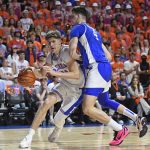 Florida forward/center Alex Condon (21) drives against Kentucky forward Andrija Jelavic (4) as the Florida Gators face the Kentucky Wildcats at the Stephen C. O’Connell Center on Saturday, Feb. 14, 2026, in Gainesville, Fla.