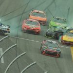 Tyler Reddick (center) survived the last-lap carnage at Daytona International Speedway to earn his first career Daytona 500 victory.