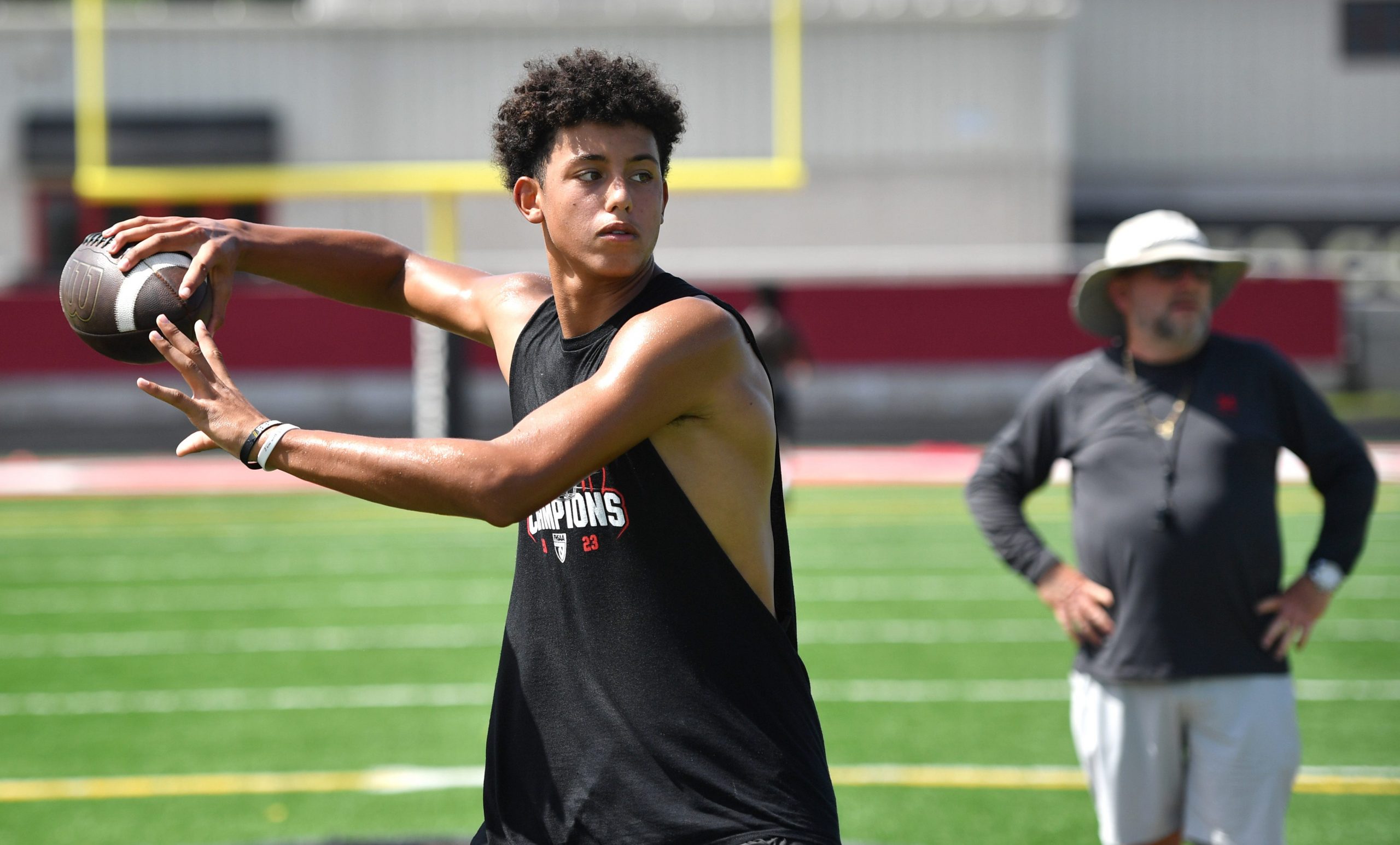 Quarterback Davin Davidson passes the ball during 7-on-7 drills. Cardinal Mooney High football players participate in the school's summer strength and conditioning camp Monday, July 22, 2024. The Cougars won the FHSAA Class 1S state championship last year, defeating Trinity Catholic.