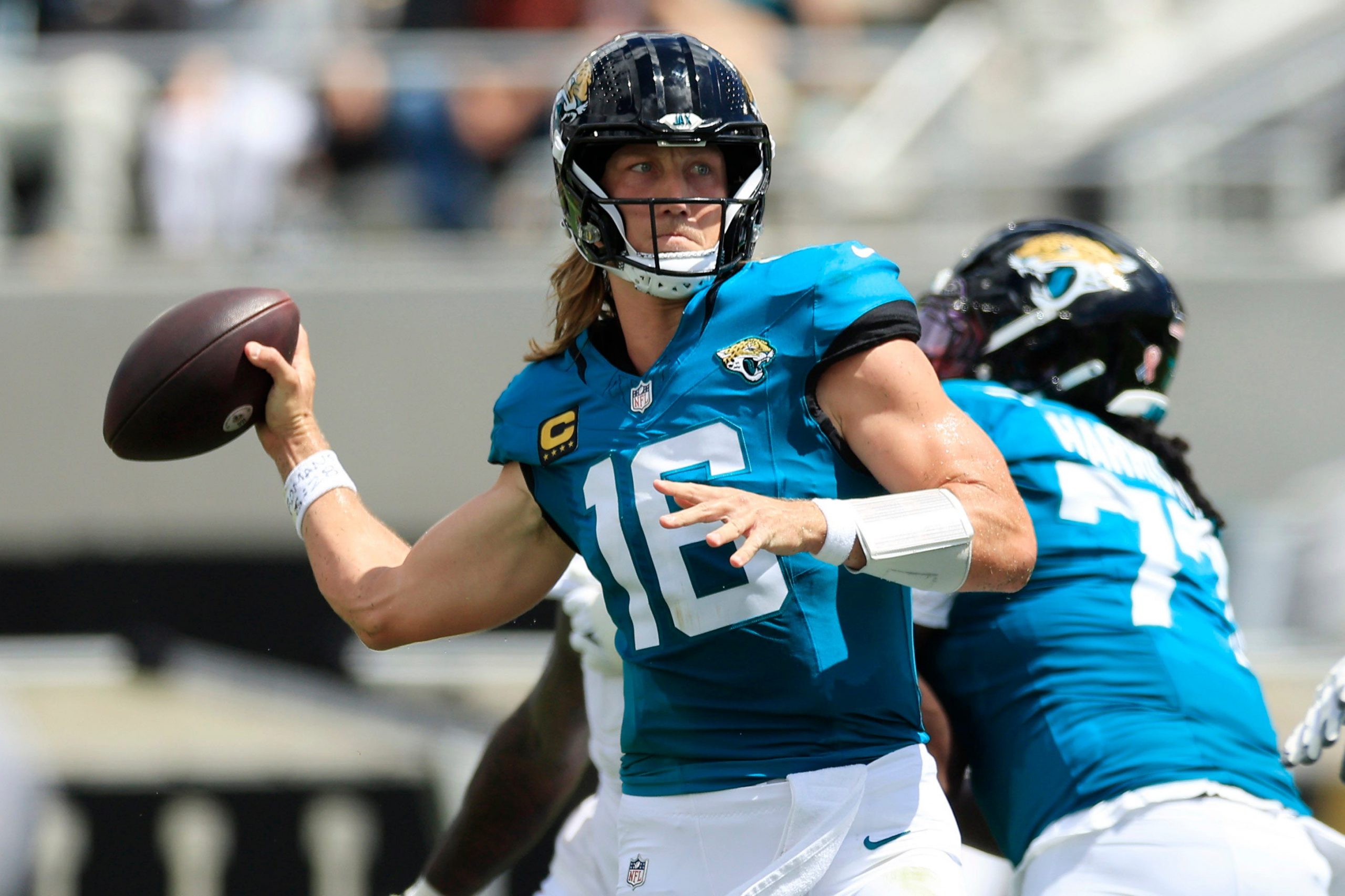 Jacksonville Jaguars quarterback Trevor Lawrence (16) throws a touchdown pass to wide receiver Parker Washington (11), not shown, during the first quarter of an NFL football matchup at EverBank Stadium on Sunday, Sept. 13, 2026, in Jacksonville, Fla.