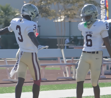 ‘Batman & Superman’ Have Oak Hall Football Rolling
