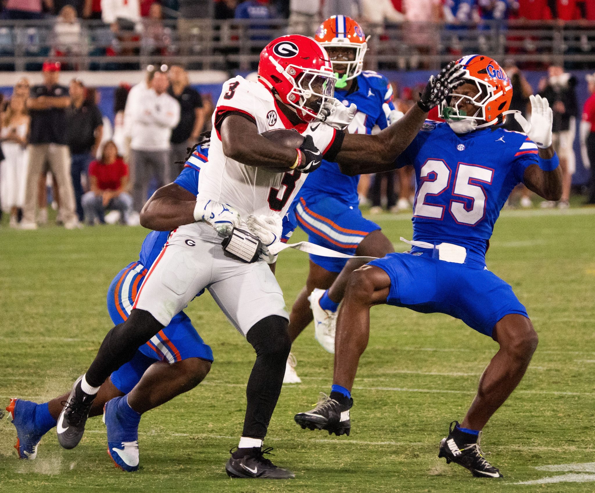 Georgia running back Nate Frazier (3) pushes off Florida Gators defensive back Cormani McClain (25) in the second half on Nov. 1, 2025. Georgia defeated Florida 24-20. (Doug Engle/Florida Times-Union / USA TODAY NETWORK via Imagn Images)