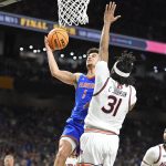Florida guard Walter Clayton Jr. (1) goes up against Auburn forward Chaney Johnson (31) as the Florida Gators face the Auburn Tigers on Saturday, April 5, 2025, at the Alamodome in San Antonio, Texas. (Matthew Lewis/WRUF)