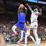 Florida guard Denzel Aberdeen (11) fades away for a midrange jumper as the Florida Gators face the Auburn Tigers on Saturday, April 5, 2025, at the Alamodome in San Antonio, Texas. (Matthew Lewis/WRUF)
