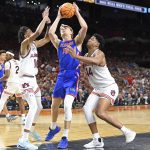 Florida forward Thomas Haugh (10) is fouled by Auburn center Dylan Cardwell (44) as the Florida Gators face the Auburn Tigers on Saturday, April 5, 2025, at the Alamodome in San Antonio, Texas. (Matthew Lewis/WRUF)