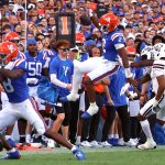 University of Florida's DJ Lagway (#2) leaps with the ball during the first quarter of the Gators’ game against the Mississippi State Bulldogs at Ben Hill Griffin Stadium in Gainesville, Fla., Saturday night, Oct. 18, 2025. (Libby Clifton/WRUF)