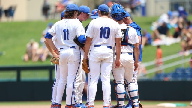 Gators manager Kevin O'Sullivan visits the mound in the sixth inning after Sandefer gave up a single that lead to a stolen base and walked a batter. (Photo by Ryan Scarane/WRUF)