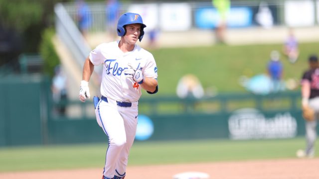 Cade Kurland jogs past third base on his way to home plate after his two-run homer puts the Gators back in the lead in the eighth inning. (Photo by Ryan Scarane/WRUF)