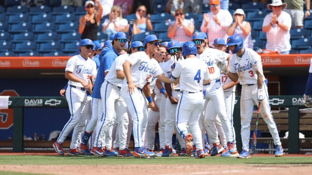 The Gators dugout celebrates with Cade Kurland after his two-run homer in the eighth inning. (Photo by Ryan Scarane/WRUF)
