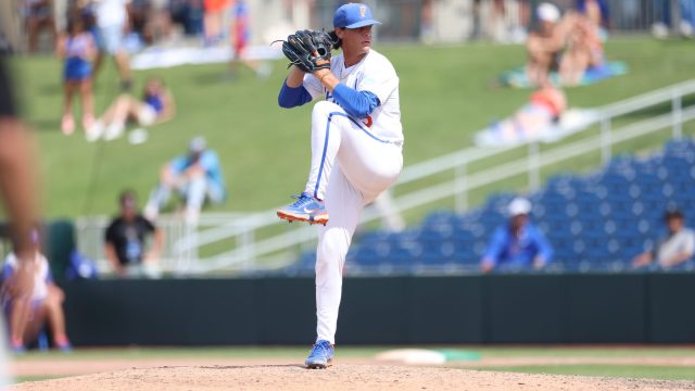 Joshua Whritenour warms up on the mound in the ninth inning, replacing Jaden Barberi in the eighth inning. (Photo by Ryan Scarane/WRUF)