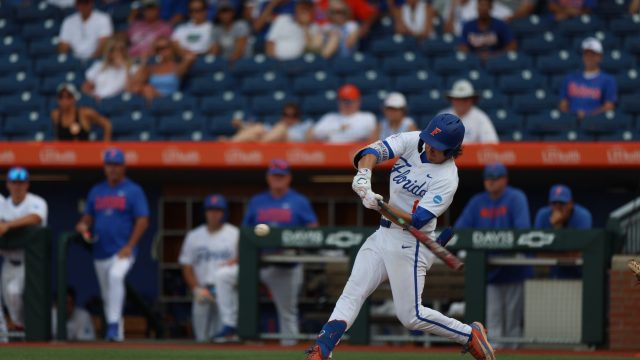 Brendan Lawson swings at an outside corner pitch that lead to him hitting the winning home run, as the Gators previal in Gainesville, 8-7. (Photo by Ryan Scarane/WRUF)