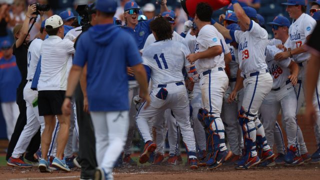 The Florida dugout celebrates the win against Rider after a walk-off homer by Brendan Lawson. (Photo by Ryan Scarane/WRUF)