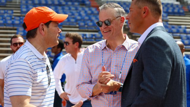 US Secretary of State Marco Rubio (left) speaks to UF athletic director Scott Stricklin (middle) and UF head coach Jon Sumrall (right) at Ben Hill Griffin stadium before an NCAA college football game against Campbell College,Saturday, Sept. 12,2026, in Gainesville, Fla. (Reagan Bresnahan/ WRUF)